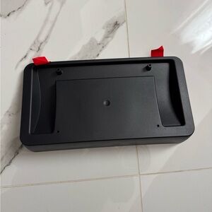 Tesla OEM front license plate mount